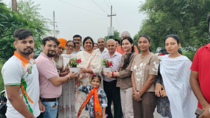 Mayor Suman Bahmani and students participate in a tree plantation drive at Anand Lok City Park in Yamunanagar.