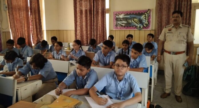 Students taking part in the school-level traffic quiz examination in Yamunanagar.