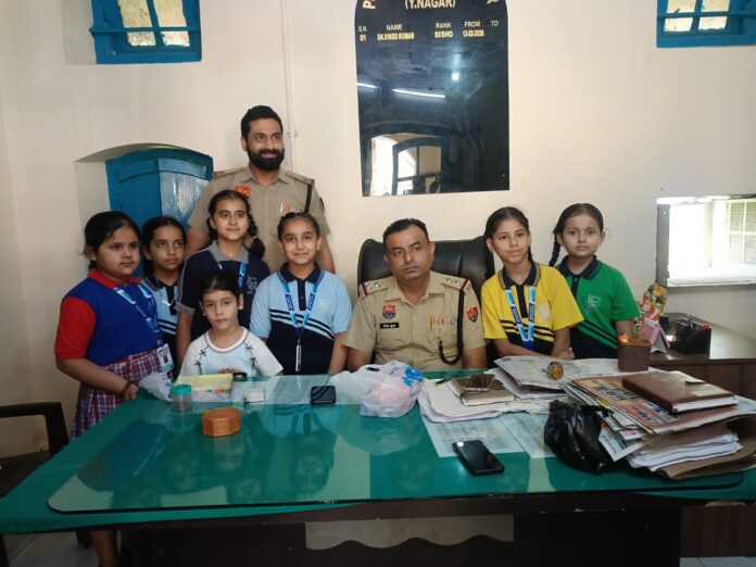 Students of New Happy Public School Vyas Pur tie rakhis to police personnel during Raksha Bandhan celebrations in Yamunanagar