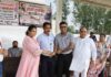 Krida Bharati Launches Sports Fortnight in Yamunanagar with Hockey Competition District Sports Officer Shilpa Gupta with young hockey players at a Krida Bharati sports event in Yamunanagar.