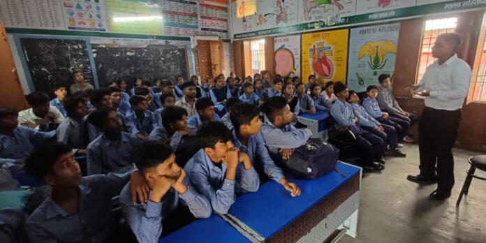 Students learning about four-bin waste segregation during a Municipal Corporation awareness programme at Government Senior Secondary School Govindpura.