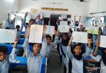 ‘Har Ghar Tiranga, Har Ghar Swachhta’ Theme Inspires Students at Drawing Competition in Chandpur Students displaying drawings on patriotism and cleanliness during a Har Ghar Tiranga competition in Chandpur