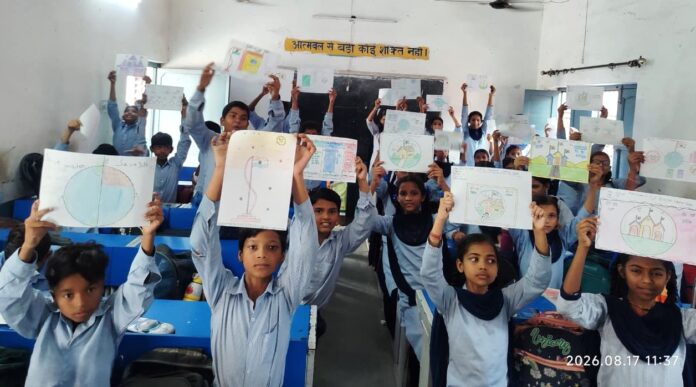 Students displaying drawings on patriotism and cleanliness during a Har Ghar Tiranga competition in Chandpur