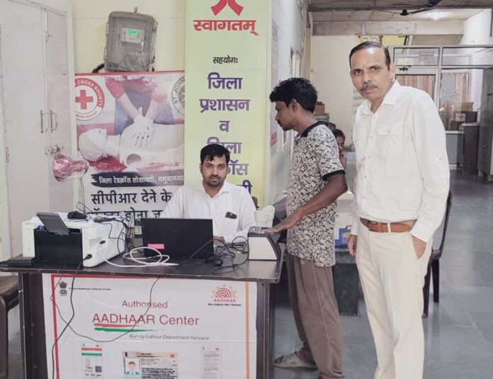 Sanjeev Dhiman, Officiating Secretary of District Red Cross Society Yamunanagar, announces Aadhaar Centre services at Red Cross Building Sector 17, Jagadhri.