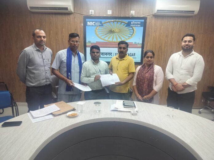 Electoral Registration Officer and SDM Narendra Kumar handing over electoral roll claim and objection forms to political representatives and Booth Level Agents during Special Intensive Revision 2026 in Radaur.