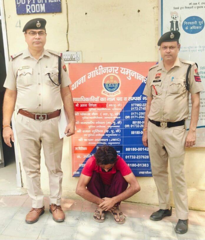 Gandhinagar Police officers with a suspect arrested in an alleged AC copper pipe theft case in Yamunanagar