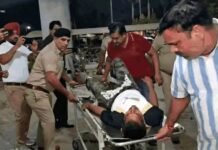 Police Identify Two Main Shooters in Harbhajan Singh Murder Case in Yamunanagar Police personnel escort injured Harbhajan Singh on a stretcher after the shooting outside Jack Fitness Gym in Model Town, Yamunanagar