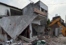 Municipal Corporation Demolishes Illegal Two-Storey House Linked to Alleged Drug Traffickers in Yamunanagar Municipal Corporation team demolishing an unauthorised two-storey house in Khadda Colony Yamunanagar