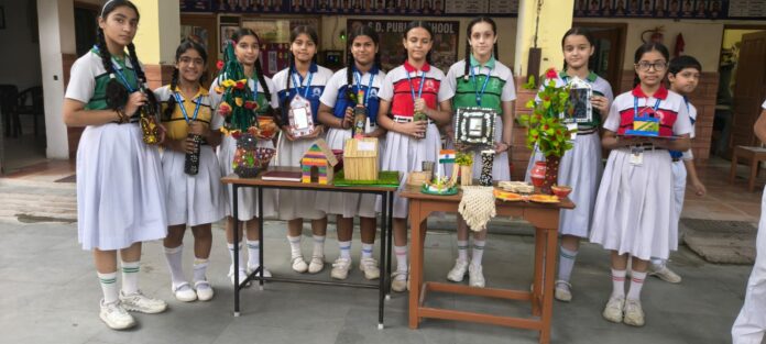 SD Public School Waste to Art Save Trees Yamunanagar SD Public School students display waste-to-art creations and plants during an environmental awareness programme in Yamunanagar
