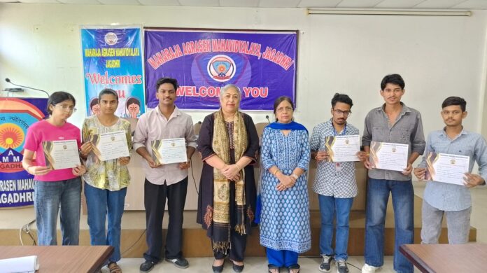 Students participating in Economics poster-making competition at Maharaja Agrasen College