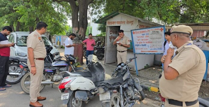 Yamunanagar Police officers check vehicles during a special drive against vehicles without HSRP and number plates
