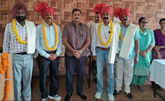 Retiring Yamunanagar Police personnel with senior officers at a farewell ceremony in Jagadhri