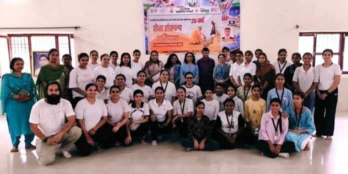 DAV Girls College students and Municipal Corporation employees practising yoga during a camp at Nehru Park, Yamunanagar